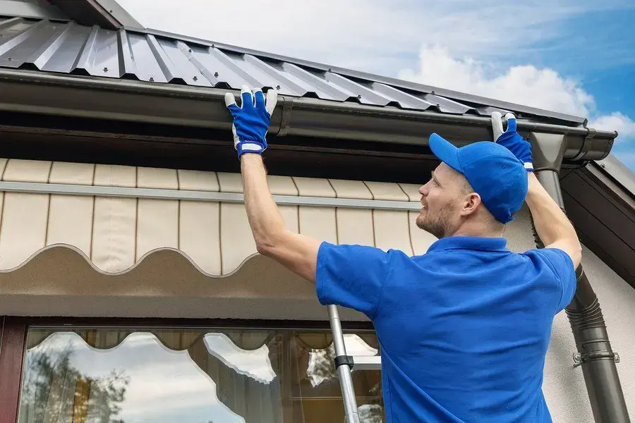 DIY Gutter Cleaning work on a residential gutter system