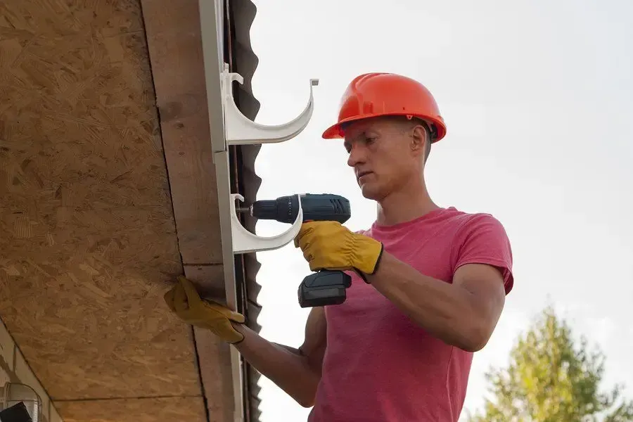 Removing loose debris from the edge of a roof