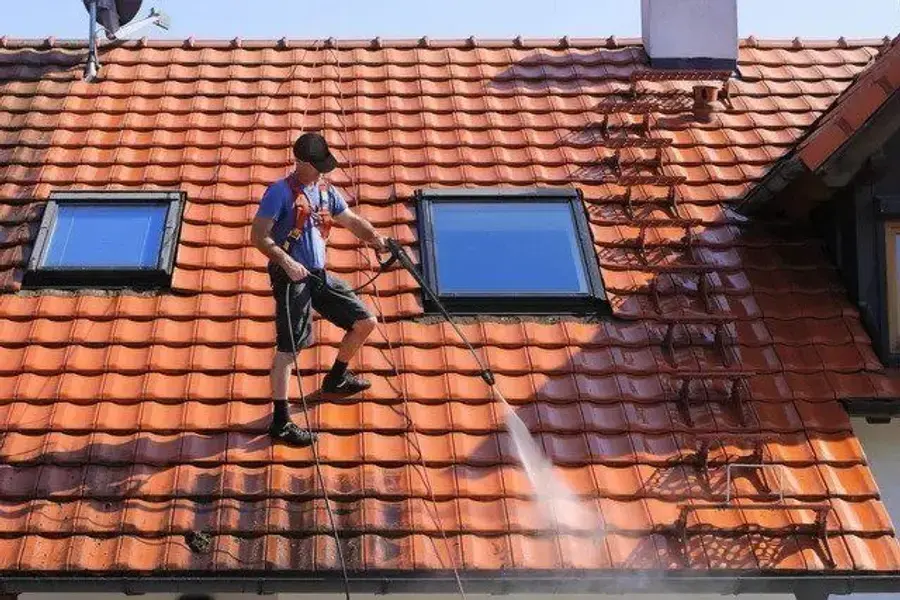 Roof Cleaning work on a residential gutter system